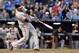 Cruz swinging at a pitch