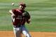 Arkansas' Michael Bernal throws to first during the second inning against Mississippi at the Southeastern Conference NCAA college baseball tournament on Friday, May 23, 2014, in Hoover, Ala. (AP Photo/Butch Dill)