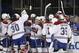 The Montreal Canadiens celebrate after defeating the New York Rangers 3-2 in overtime in Game 3 of the NHL hockey Stanley Cup playoffs Eastern Conference finals, Thursday, May 22, 2014, in New York. (AP Photo/Kathy Willens)