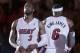Miami Heat guard Dwyane Wade (3) and forward LeBron James (6) stand during player introductions before the start of an NBA basketball game against the Brooklyn Nets, Wednesday, March 12, 2014 in Miami. (AP Photo/Wilfredo Lee)