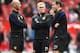 MANCHESTER, ENGLAND - APRIL 26: l-r Nicky Butt, Paul Scholes and Phil Neville of Manchester United watch over the players during warm up during the Barclays Premier League match between Manchester United and Norwich City at Old Trafford on April 26, 2014 in Manchester, England. (Photo by Laurence Griffiths/Getty Images)