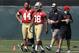 Fullback Trey Millard (44) and running back Marcus Lattimore (38) walk on the practice field during the San Francisco 49ers' NFL football rookie camp in Santa Clara, Calif., Friday, May 23, 2014. (AP Photo/Jeff Chiu)