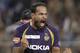 Kolkata Knight Riders' Yusuf Pathan gestures after taking the wicket of Royal Challengers Bangalore's Tillakaratne Dilshan, unseen, during the Indian Premier League (IPL) cricket match in Kolkata, India, Saturday, April 28, 2012. (AP Photo/Bikas Das)