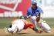 Miami's Jacob Hayward (28) gets back to second base safely as Duke shortstop Matt Berezo makes the catch from the pitcher during the 12th inning of Game 12 of the Atlanta Coast Conference college baseball tournament in Greensboro, N.C., Saturday, May 24, 2014. Miami won 6-4 in 12 innings. (AP Photo/Bob Leverone)