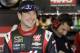 Kurt Busch smiles following practice for Sunday's NASCAR Sprint Cup series Coca-Cola 600 auto race at the Charlotte Motor Speedway in Concord, N.C., Saturday, May 24, 2014. (AP Photo/Gerry Broome)