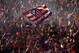 MADRID, SPAIN - MAY 18: Club Atletico de Madrid fans celebrate as they wait for the players after their tenth La Liga title at Neptuno Square on May 18, 2014 in Madrid, Spain. (Photo by Pablo Blazquez Dominguez/Getty Images)
