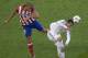 Atletico's Miranda, left, and Real's Cristiano Ronaldo vie for the ball during the Champions League final soccer match between Atletico Madrid and Real Madrid in Lisbon, Portugal, Saturday, May 24, 2014. (AP Photo/Paulo Duarte)