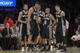 San Antonio Spurs, from left, Marco Belinelli, of Italy, Tim Duncan, Kawhi Leonard, Patty Mills, of Australia, and Danny Green wait during a timeout in the second half of their NBA basketball game, Wednesday, March 19, 2014, in Los Angeles. The Spurs won 125-109. (AP Photo/Mark J. Terrill)