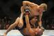 May 24, 2014; Las Vegas, NV, USA; Bantamweight Champion Renan Barao (red) is pinned down by TJ Dillashaw (blue) during their UFC 173 bantamweight championship bout at MGM Grand Garden Arena. Mandatory Credit: Stephen R. Sylvanie-USA TODAY Sports
