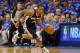 OKLAHOMA CITY, OK - MAY 25: Kawhi Leonard #2 of the San Antonio Spurs dribbles after a turnover in the first quarter against the Oklahoma City Thunder during Game Three of the Western Conference Finals of the 2014 NBA Playoffs at Chesapeake Energy Arena on May 25, 2014 in Oklahoma City, Oklahoma. (Photo by Ronald Martinez/Getty Images)