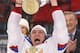 Russia forward Alexander Ovechkin celebrates as he holds up the trophy after Russia defeated Finland 5-2 in the gold medal match at the Ice Hockey World Championship in Minsk, Belarus, Sunday, May 25, 2014. (AP Photo/Darko Bandic)
