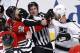 Chicago Blackhawks defenseman Michal Rozsival (32) and Los Angeles Kings center Jeff Carter get into a pushing match during the third period of Game 1 of the Western Conference finals in the NHL hockey Stanley Cup playoffs in Chicago on Sunday, May 18, 2014. The Blackhawks won 3-1. (AP Photo/Charles Rex Arbogast)
