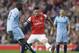Arsenal's Olivier Giroud, center, competes for the ball with Manchester City's Yaya Toure, left, during the English Premier League soccer match between Arsenal and Manchester City at the Emirates stadium in London, Saturday, March 29, 2014. (AP Photo/Kirsty Wigglesworth)