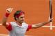 Switzerland's Roger Federer thumbs up after defeating Slovakia's Lukas Lacko in the first round match of the French Open tennis tournament at the Roland Garros stadium, in Paris, France, Sunday, May 25, 2014. Federer won 6-2, 6-4, 6-2. (AP Photo/Darko Vojinovic)