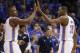 Oklahoma City Thunder forward Serge Ibaka (9) and forward Kevin Durant (35) exchange high-fives in the fourth quarter of Game 3 of an NBA basketball playoff series in the Western Conference finals against the San Antonio Spurs, Sunday, May 25, 2014, in Oklahoma City. Oklahoma City won 106-97. Durant scored 25 points and 10 rebounds. Ibaka had 15 points. (AP Photo/Sue Ogrocki)