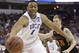 Duke forward Jabari Parker (1) works against Mercer forward Jakob Gollon (20) during the first half of an NCAA college basketball second-round game, Friday, March 21, 2014, in Raleigh, N.C. (AP Photo/Gerry Broome)