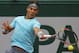 Spain's Rafael Nadal returns the ball to Robby Ginepri of the U.S. during the first round match of the French Open tennis tournament at the Roland Garros stadium, in Paris, France, Monday, May 26, 2014. (AP Photo/Michel Spingler)