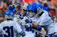 BALTIMORE, MD - MAY 24: Christian Walsh #19 of the Duke Blue Devils (C) celebrates after scoring a second half goal against the Denver Pioneers during the semifinals of the 2014 NCAA Division I Men's Lacrosse Championship at M&T Bank Stadium on May 24, 2014 in Baltimore, Maryland. (Photo by Rob Carr/Getty Images)