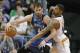 Minnesota Timberwolves forward Kevin Love, left, backs down Phoenix Suns forward Markieff Morris during the second half of an NBA basketball game, Tuesday, Feb. 25, 2014, in Phoenix. (AP Photo/Matt York)