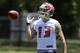 Tampa Bay Buccaneers first-round draft pick Mike Evans flips the football during NFL football rookie camp Friday, May 16, 2014, in Tampa, Fla. Evans, the seventh pick overall, played at Texas A&M. (AP Photo/Chris O'Meara)