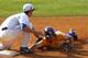 Florida's Zack Powers (5) tags LSU's Alex Bregman (8) out as he is picked off at first base during the eighth inning at the Southeastern Conference NCAA college baseball tournament on Sunday, May 25, 2014, in Hoover, Ala. (AP Photo/Butch Dill)