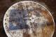 Rain falls on the dirty on deck circle with the Major League Baseball logo on it during a baseball game between the Washington Nationals and the Cincinnati Reds at Nationals Park Wednesday, May 21, 2014, in Washington. (AP Photo/Alex Brandon)