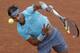Rafael Nadal plays during his first-round match on Suzanne Lenglen at the 2014 French Open.