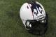 A Connecticut football helmet with new logo is seen during NCAA college football media day in Storrs, Conn., Friday, Aug. 9, 2013. (AP Photo/Jessica Hill)