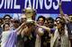 Kolkata Knight Riders team co-owners and Bollywood actors Shah Rukh Khan, center and Juhi Chawla, second right, pose with West Bengal state Chief Minister Mamata Banerjee, left, and captain Gautam Gambhir, second left in cap, during a reception accorded to the team at the Eden Gardens stadium in Kolkata, India, Tuesday, May 29, 2012. Kolkata Knight Riders won the Indian Premier League cricket title on Sunday, defeating two-time defending champion Chennai Super Kings by five wickets in a high-scoring final. (AP Photo)