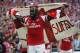 Arsenal's Bacary Sagna celebates their win against Hull City at the end of their English FA Cup final soccer match at Wembley Stadium in London, Saturday, May 17, 2014. (AP Photo/Sang Tan)
