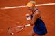 PARIS, FRANCE - MAY 27: Kristina Mladenovic of France celebrates a point during her women's singles match against Na Li of China on day three of the French Open at Roland Garros on May 27, 2014 in Paris, France. (Photo by Clive Brunskill/Getty Images)