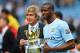 MANCHESTER, ENGLAND - MAY 11: The Manchester City Manager Manuel Pellegrini and Yaya Toure pose with the trophy at the end of the Barclays Premier League match between Manchester City and West Ham United at the Etihad Stadium on May 11, 2014 in Manchester, England. (Photo by Shaun Botterill/Getty Images)