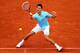 PARIS, FRANCE - MAY 26: Novak Djokovic of Serbia returns a shot during his men's singles match against Joao Sousa of Portugal on day two of the French Open at Roland Garros on May 26, 2014 in Paris, France. (Photo by Clive Brunskill/Getty Images)