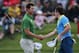 Adam Scott and Rory McIlroy shake hands last year in Australia.