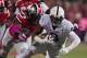 Oct 26, 2013; Columbus, OH, USA; Ohio State Buckeyes defensive end Jamal Marcus (34) tackles Penn State Nittany Lions wide receiver Allen Robinson (8) at Ohio Stadium. Mandatory Credit: Greg Bartram-USA TODAY Sports