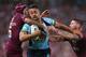 BRISBANE, AUSTRALIA - MAY 28: Jarryd Hayne of the Blues breaks through the defence of Johnathan Thurston and Chris McQueen of the Maroons to score a try during game one of the State of Origin series between the Queensland Maroons and the New South Wales Blues at Suncorp Stadium on May 28, 2014 in Brisbane, Australia. (Photo by Chris Hyde/Getty Images)