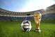 RIO DE JANEIRO, BRAZIL - DECEMBER 03: A general view of Brazuca and the FIFA World Cup Trophy at the Maracana before the adidas Brazuca launch at Parque Lage on December 3, 2013 in Rio de Janeiro, Brazil. Brazuca is the Official Match Ball for the FIFA World Cup 2014 Brazil. Tonight adidas revealed brazuca to the world in the stunning setting of Parque Lage in Rio de Janeiro. The reveal was part of a spectacular light projection supported by global footballers Seedorf, Hernane and FIFA World Cup Winner Cafu. Hundreds of guests and celebrities were treated to this one off experience, which launched the Official FIFA World Cup Ball for Brazil 2014. For more information visit: news.adidas.com/worldcupOMB (Photo by Alexandre Loureiro/Getty Images for adidas)