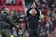Liverpool's manager Brendan Rodgers applauds supporters after his team's 3-0 win against Manchester United in their English Premier League soccer match at Old Trafford Stadium, Manchester, England, Sunday March 16, 2014. (AP Photo/Jon Super)
