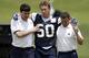 Dallas Cowboys linebacker Sean Lee is helped off the field by head athletic trainer Jim Maurer, left, and associate athletic trainer Britt Brown, right, after suffering an unknown left knee injury during an NFL football organized team activity, Tuesday, May 27, 2014, in Irving, Texas. (AP Photo/Tony Gutierrez)
