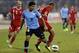 AMMAN, JORDAN- NOVEMBER 13: Luis Suarez of Uruguay and Oday Zahran of Jordan compete for the ball during the FIFA 2014 World Cup Qualifier: Intercontinental Play-off First Leg between Jordan and Uruguay on November 13, 2013 in Amman, Jordan. (Photo by Salah Malkawi/ Getty Images)