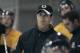 Boston Bruins director of player development Don Sweeney, center, watches play during a hockey team development camp in Wilmington, Mass. Monday, July 9, 2007.(AP Photo/Charles Krupa)