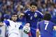 Cyprus’ Nestor Mytidis, left, fights for the ball with Japan's Masato Morishige during a friendly soccer match in Saitama, north of Tokyo, Tuesday, May 27, 2014. Japan will play against Ivory Coast, Greece and Colombia in Group C of the World Cup 2014 in Brazil. (AP Photo/Shizuo Kambayashi)