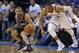 San Antonio Spurs guard Tony Parker, left, and Oklahoma City Thunder guard Russell Westbrook (0) watch a loose ball in the second quarter of Game 4 of the Western Conference finals NBA basketball playoff series in Oklahoma City, Tuesday, May 27, 2014. (AP Photo/Sue Ogrocki)