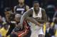 Indiana Pacers guard Lance Stephenson (1) and Miami Heat forward LeBron James (6) scramble for a loose ball during the second half of Game 5 of the NBA basketball Eastern Conference finals in Indianapolis, Wednesday, May 28, 2014. (AP Photo/Michael Conroy)