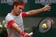 Switzerland's Roger Federer returns the ball to Argentina's Diego Sebastian Schwartzman during the second round match of the French Open tennis tournament at the Roland Garros stadium, in Paris, France, Wednesday, May 28, 2014. Federer won 6-3, 6-4, 6-4. (AP Photo/Darko Vojinovic)