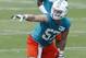 DAVIE, FL - MAY 23: Jordan Tripp #57 of the Miami Dolphins participates in drills during the rookie minicamp on May 23, 2014 at the Miami Dolphins training facility in Davie, Florida. (Photo by Joel Auerbach/Getty Images)