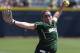 Baylor's Whitney Canion (11) pitches against Florida in the first inning of an NCAA Women's College World Series softball tournament game in Oklahoma City, Thursday, May 29, 2014. (AP Photo/Sue Ogrocki)