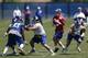 New York Giants quarterback Eli Manning, center, looks to pass during an NFL football organized team activity, Thursday, May 29, 2014, in East Rutherford, N.J. (AP Photo/Julio Cortez)