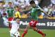 New Zealand's Michael McGlinchey, left, fights for the ball with Mexico's Oribe Peralta in the World Cup Football qualifier at Westpac Stadium in Wellington, New Zealand, Wednesday, Nov. 20, 2013. (AP Photo/SNPA, Ross Setford) NEW ZEALAND OUT