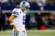 ARLINGTON, TX - DECEMBER 15: Quarterback Tony Romo #9 of the Dallas Cowboys walks off the field after losing 37-36 to the Green Bay Packers during a game at AT&T Stadium on December 15, 2013 in Arlington, Texas. (Photo by Tom Pennington/Getty Images)